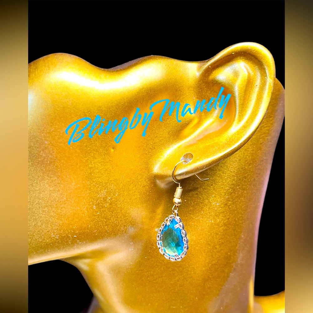 Lake blue crystal encased in gold filagree earrings -sterling